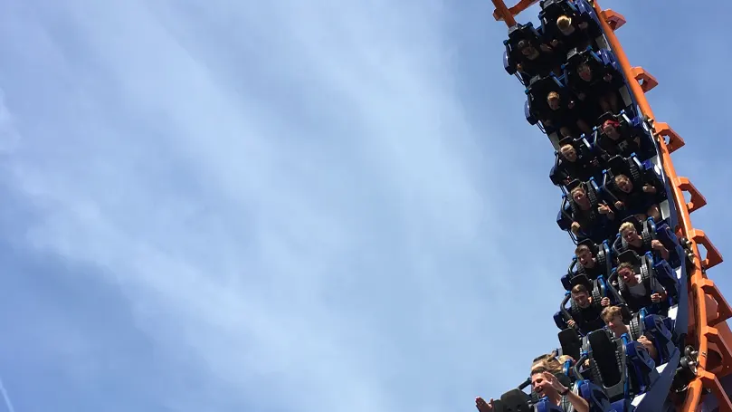 A rollercoaster full of people with lots of adrenaline.