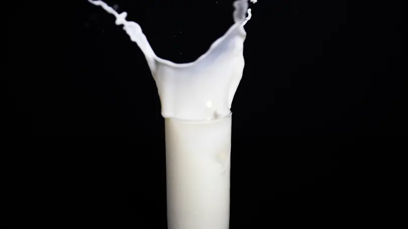 A glass of milk being splashed.