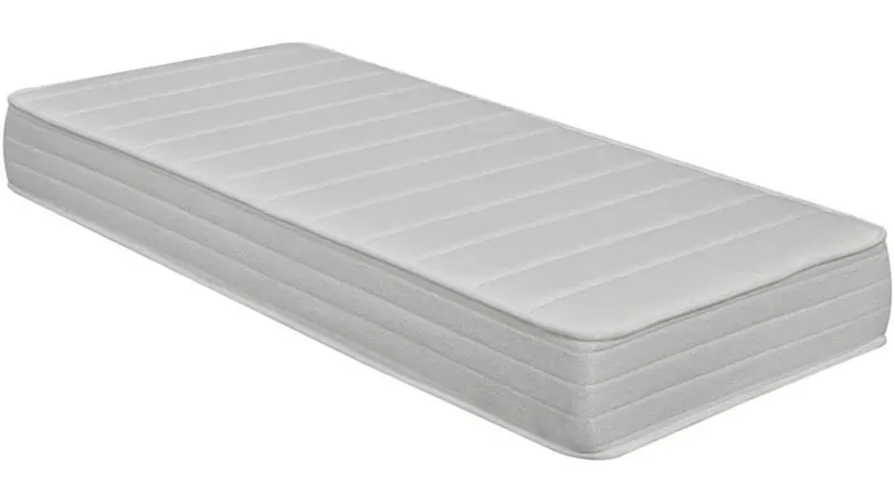 An image of a latex mattress laid on the ground