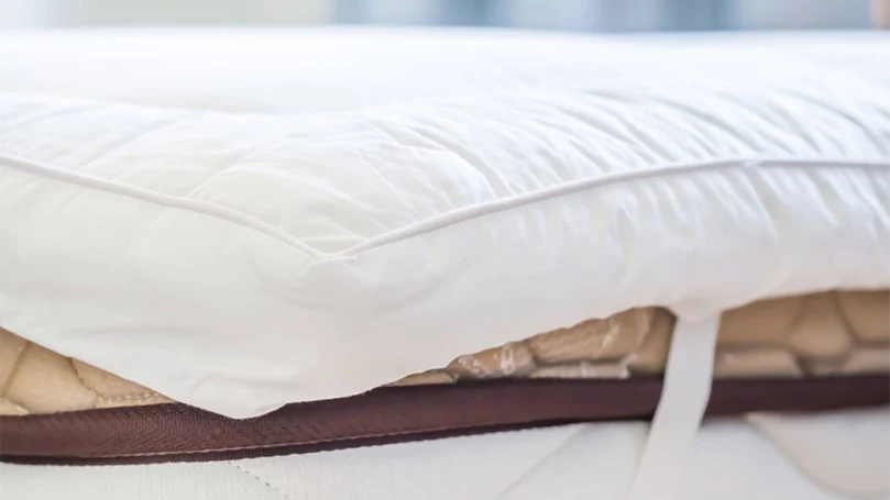 a mattress topper on a mattress