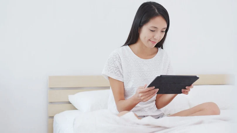 an image of a woman playing games before bed time