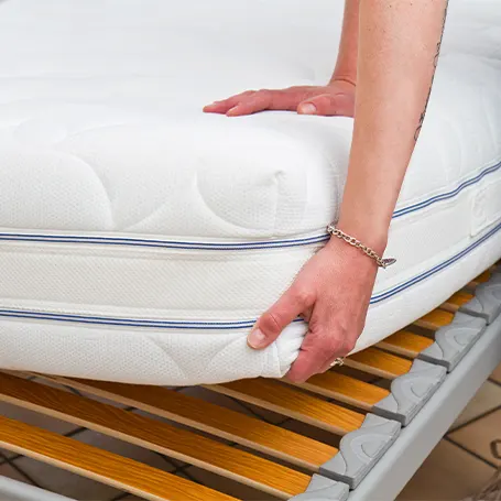man placing mattress