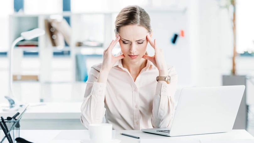a woman stressed out due to a lot of work