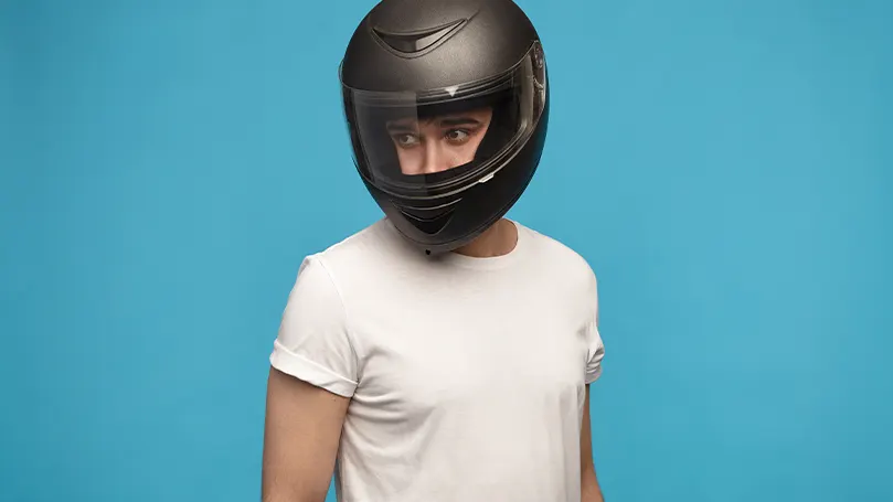 An image of a man with a helmet on his head for protection