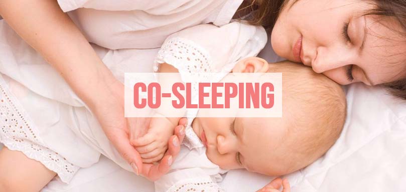 an image of a woman co sleeping with her baby