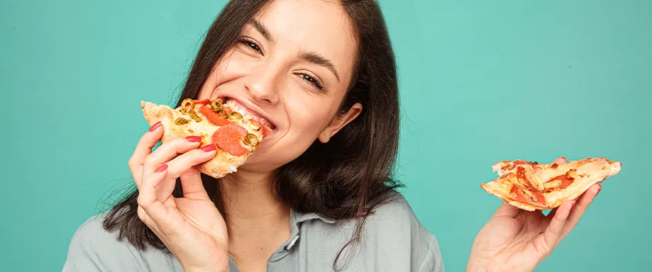 Woman eating pizza