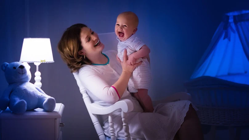an image of a mother singing to her baby