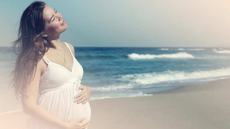 a pregnant woman dreaming of a water and fish