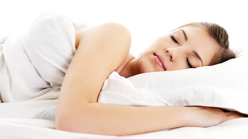 a woman sleeping comfortably at night