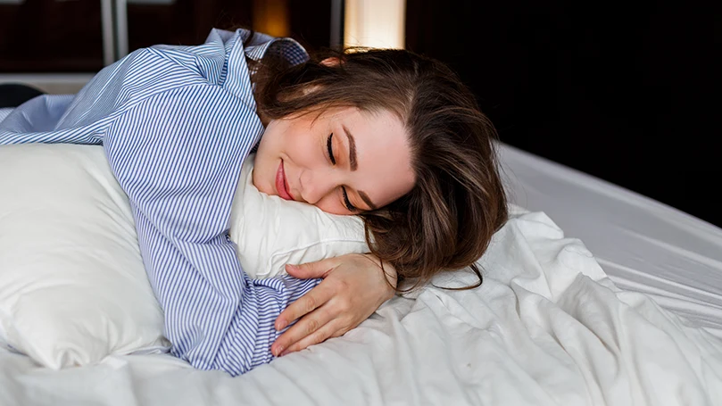 a woman sleeping on her stomach