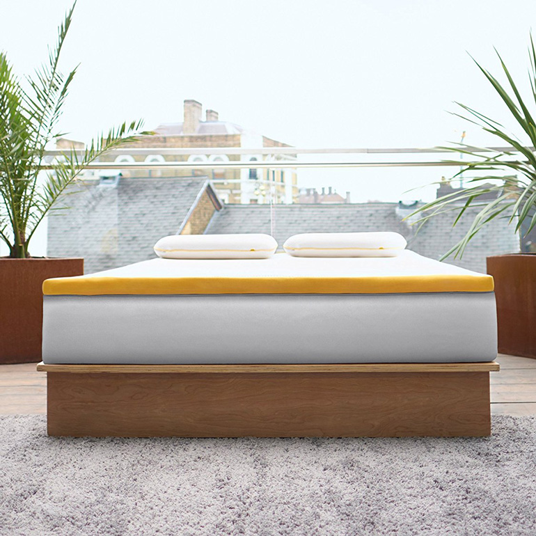 eve mattress topper on bed