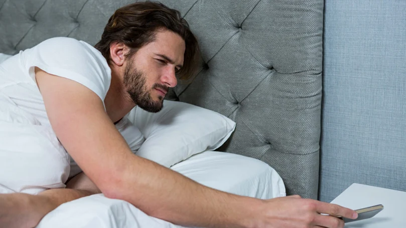 an image of a man waking up during from an afternoon nap