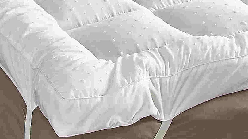 rejuvopedic mattress topper in a bedroom