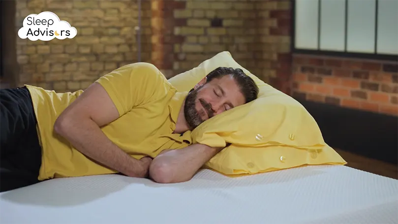 Our reviewer sleeping on Simba's Hybrid mattress