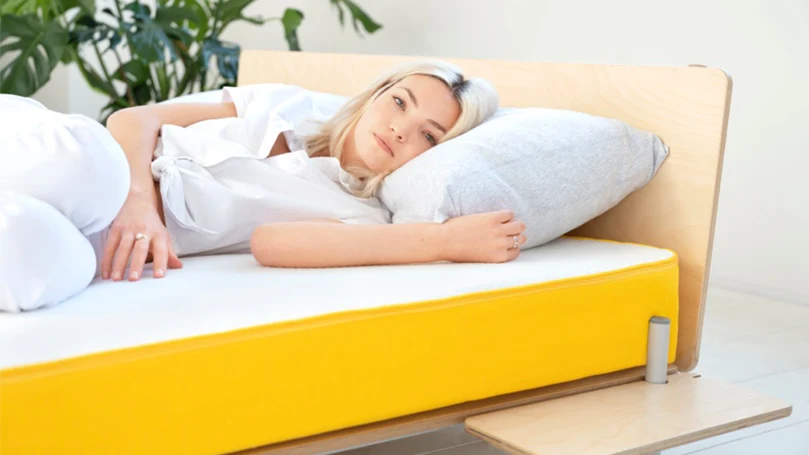 an image of a woman laying on a eve light mattress