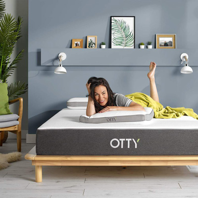 woman laying in Otty mattress hybrid