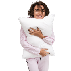 smiling girl hugging a pillow