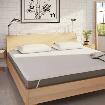 product image of Panda's mattress topper on a bed