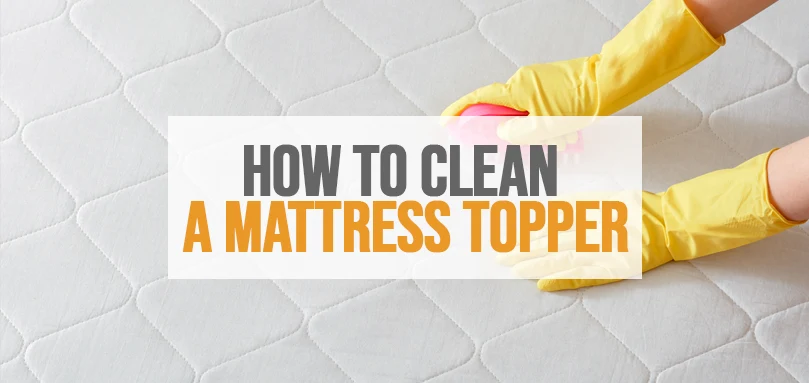 an image of a worker cleaning a mattress topper