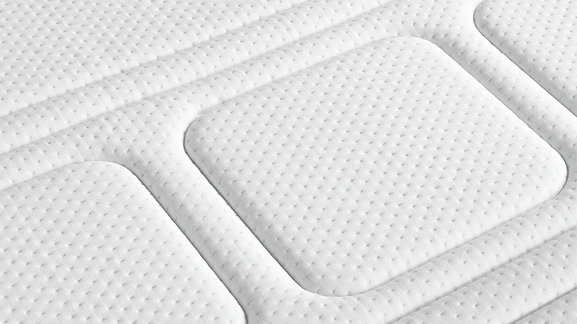 a close up image of otty pure hybrid bamboo & charcoal mattress