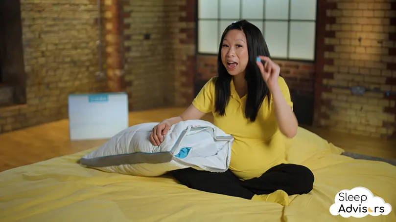 our presenter Bo sitting with Simba Hybrid pillow