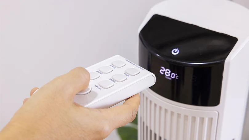 an image of a woman setting up an air purifier