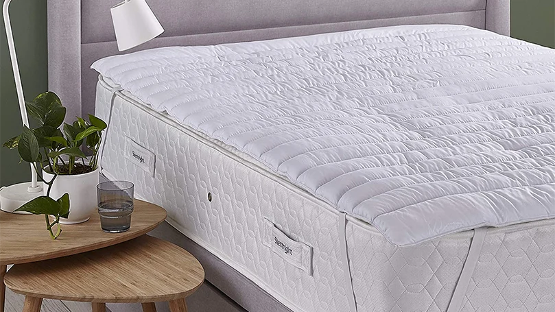 an image of Silentnight Eco Comfort mattress topper on a bed in a bedroom