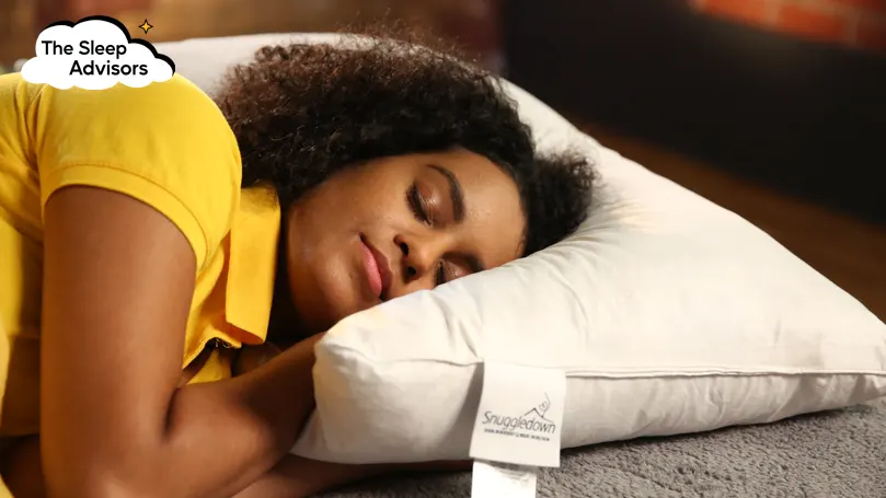 An image of a woman sleeping on a Snuggledown Goose Feather and Down pillow