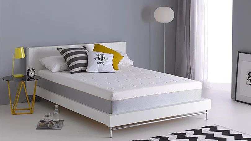 An image of dormeo hybrid latex mattress in a bedroom.