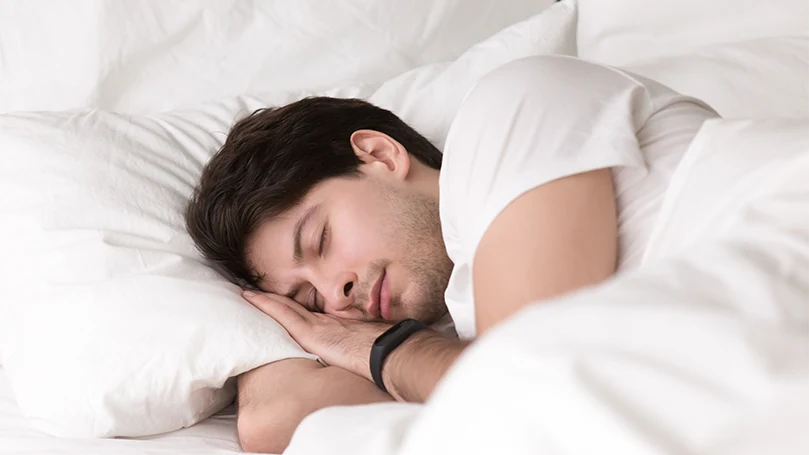 an image of a man sleeping well after the sleep hypnosis