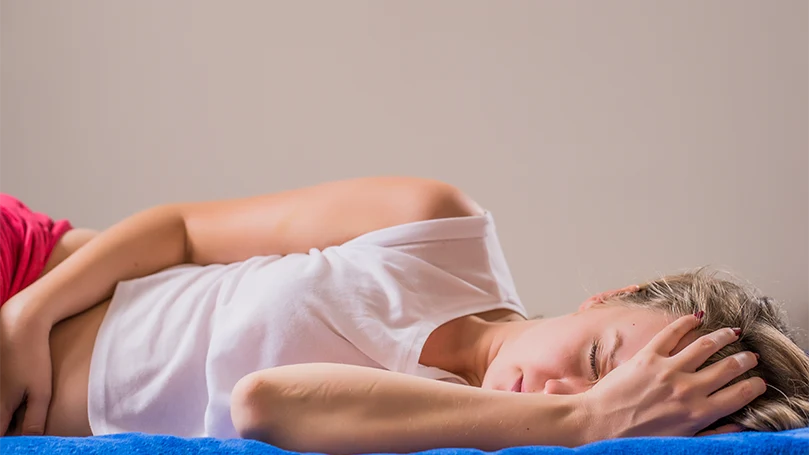 an image of a woman having a pain after sleeping on an improper mattress