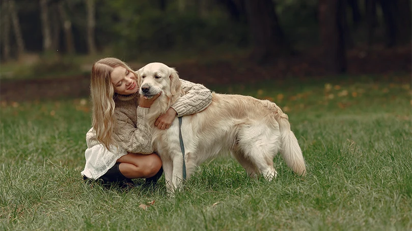 an image of a woman hugging a dog