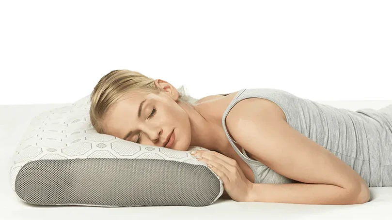 a woman laying down on Dormeo Octasense pillow