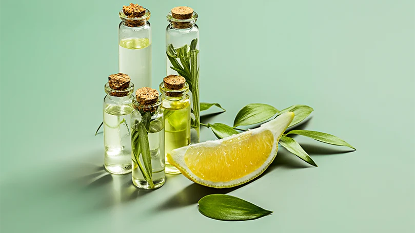 Essential oils and a slice of a lemon