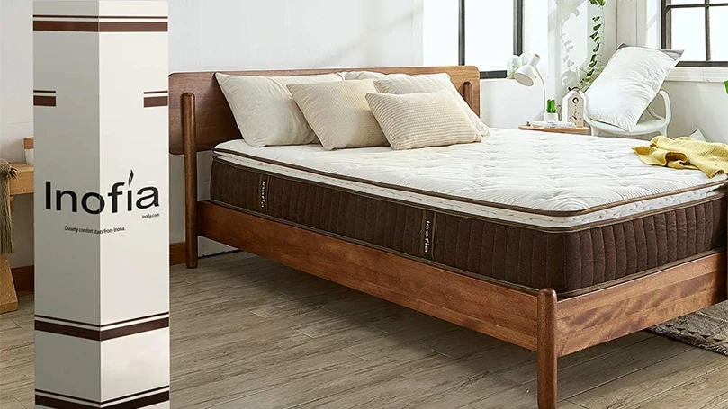 An image of inofia hybrid mattress in a bedroom.