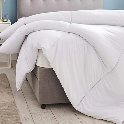 an image of silentnight deep sleep duvet on a bed in a bedroom