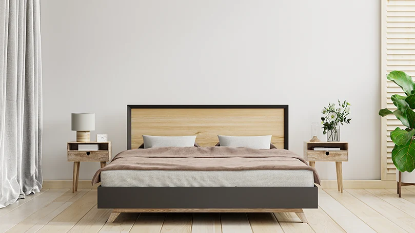 an image of a bed with nightstands in a bedroom