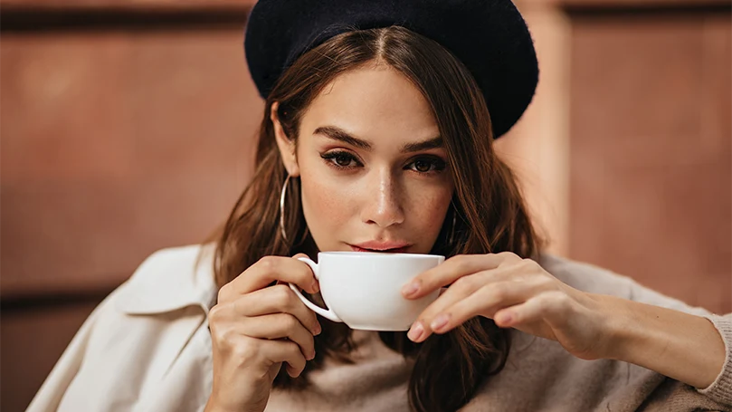 an image of a woman drinking coffee