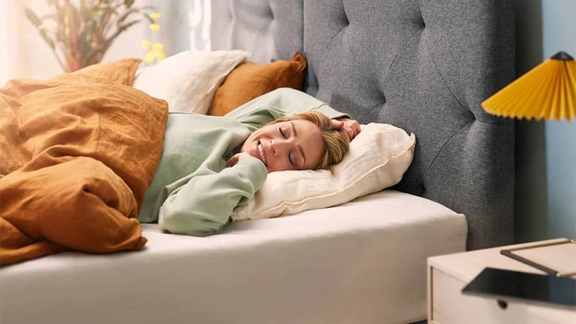 an image of a woman sleeping on Emma Original mattress