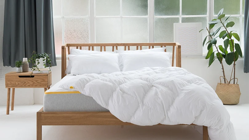 an image of eve snug duvet on a bed in a bedroom