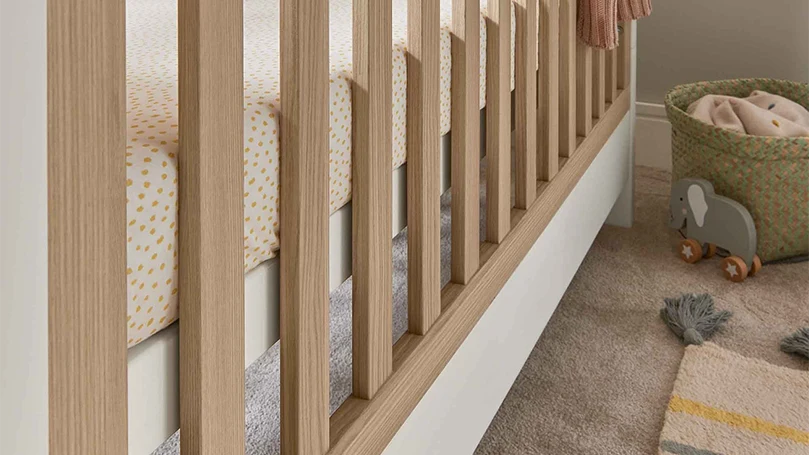 an image of a side of mamas and papas cot bed