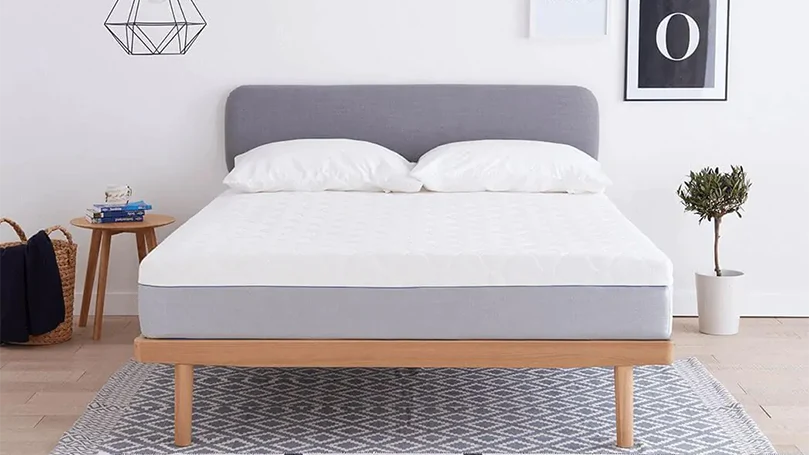 An image of Dormeo Wellsleep Hybrid mattress in a bedroom.