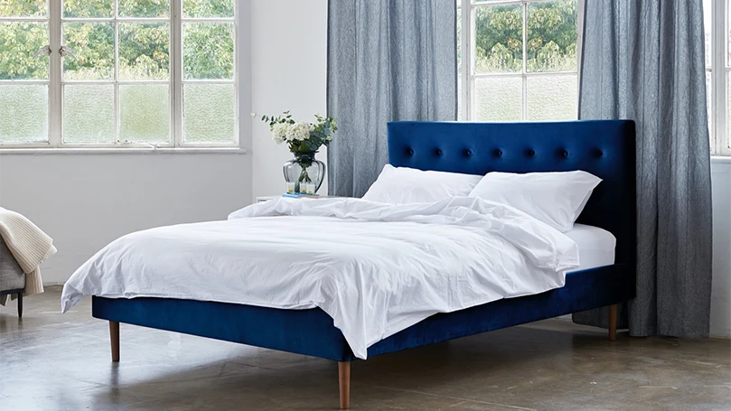 an image of Eve Button Back Storage Bed in a bedroom