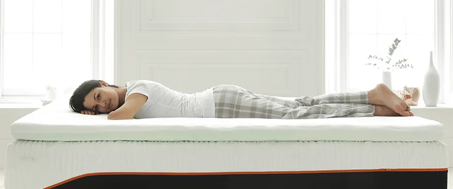 Woman on Dormeo Octaspring Classic Mattress Topper