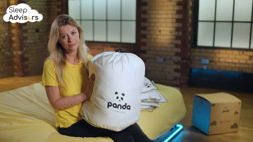 Our reviewer holding Panda duvet in her lap