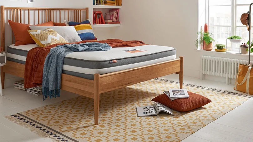 An image of Silentnight Studio Memory Hybrid mattress in a bedroom.
