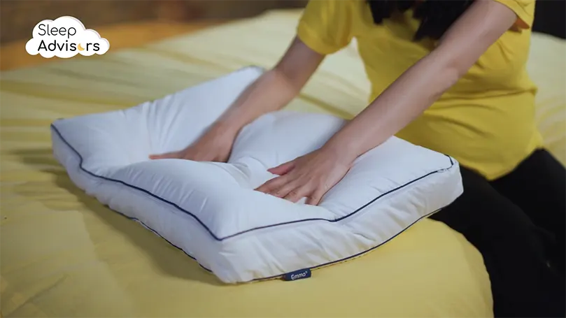 Our presenter pressing the Emma Premium Microfibre pillow with her hands