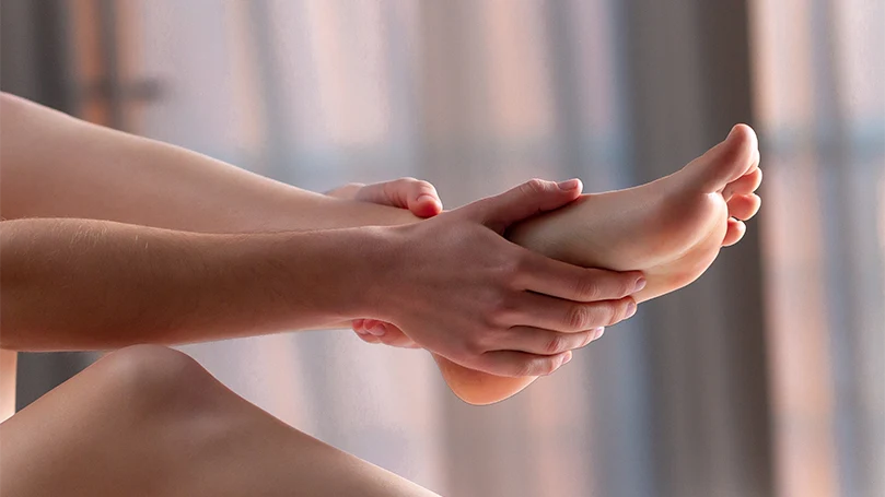 An image of a therapist massaging a woman's foot.