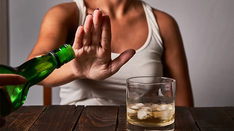 an image of a woman saying no to alcohol