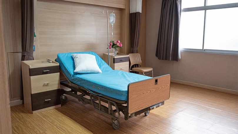An image of empty adjustable bed in a hospital.